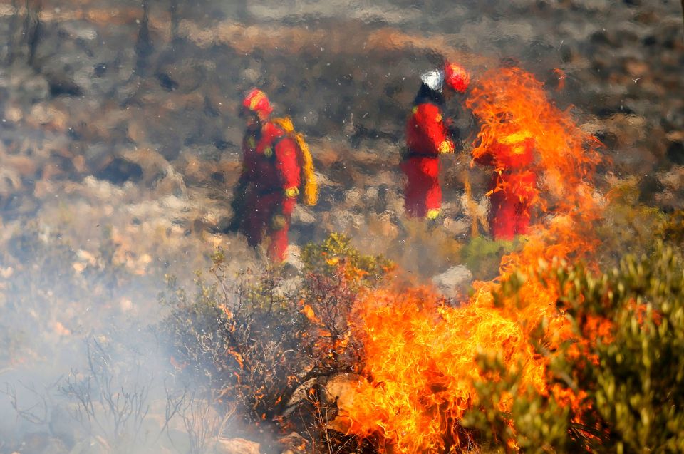  The firemen battled the inferno amid scorching hot temperatures