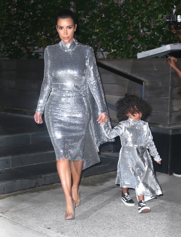  Kim poured her curves into the silver gown