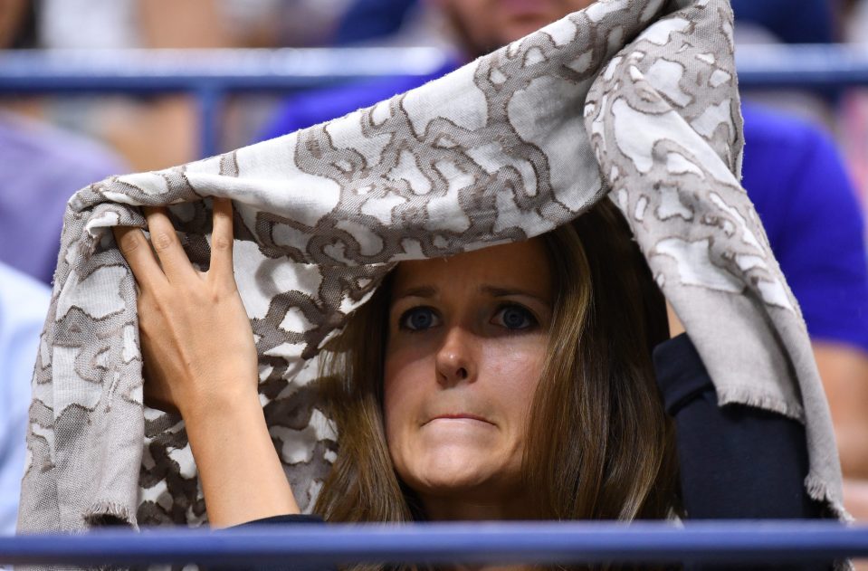  Kim Murray watches from underneath her scarf