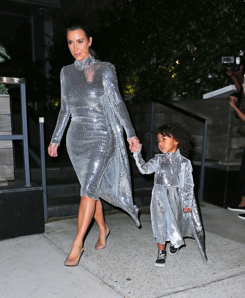  Kim wore clear heels for the outing while North sported a pair of sneakers with hers