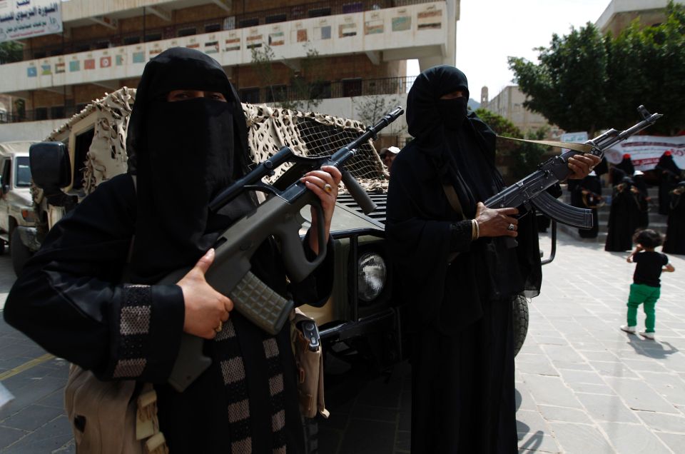  Women dressed in burkas put on a show of arms as they take to the streets to show support for the Shiite Houthi rebels at a protest rally against Saudi Arabia