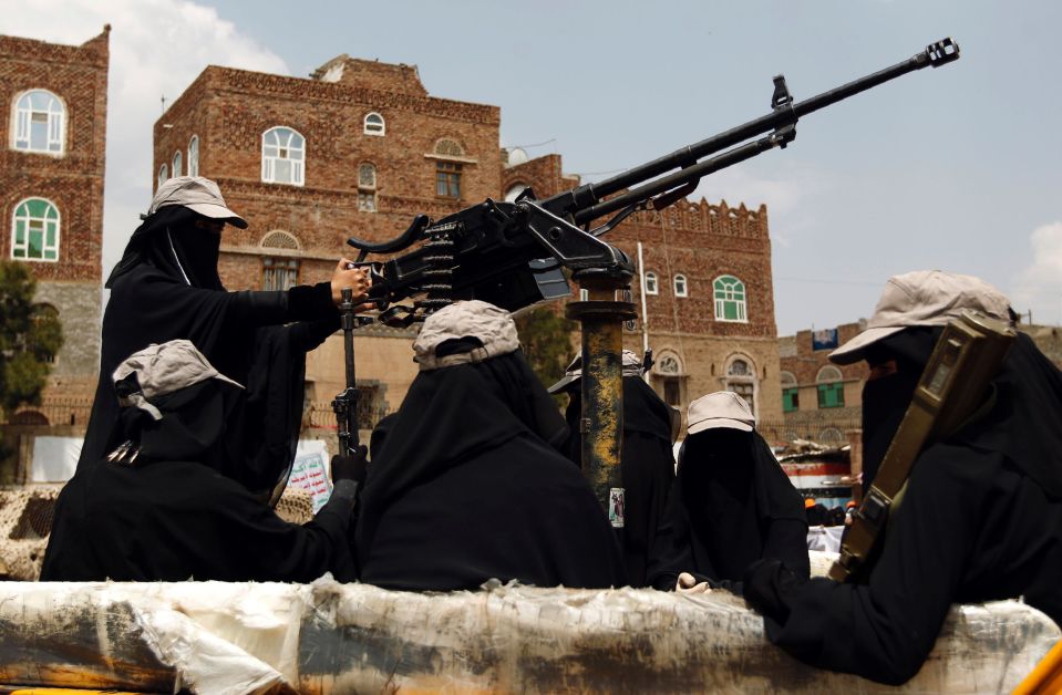  Dressed in the head to toe garments which obscured their faces, the female fighters brandished machine guns, rocket launchers and grenades