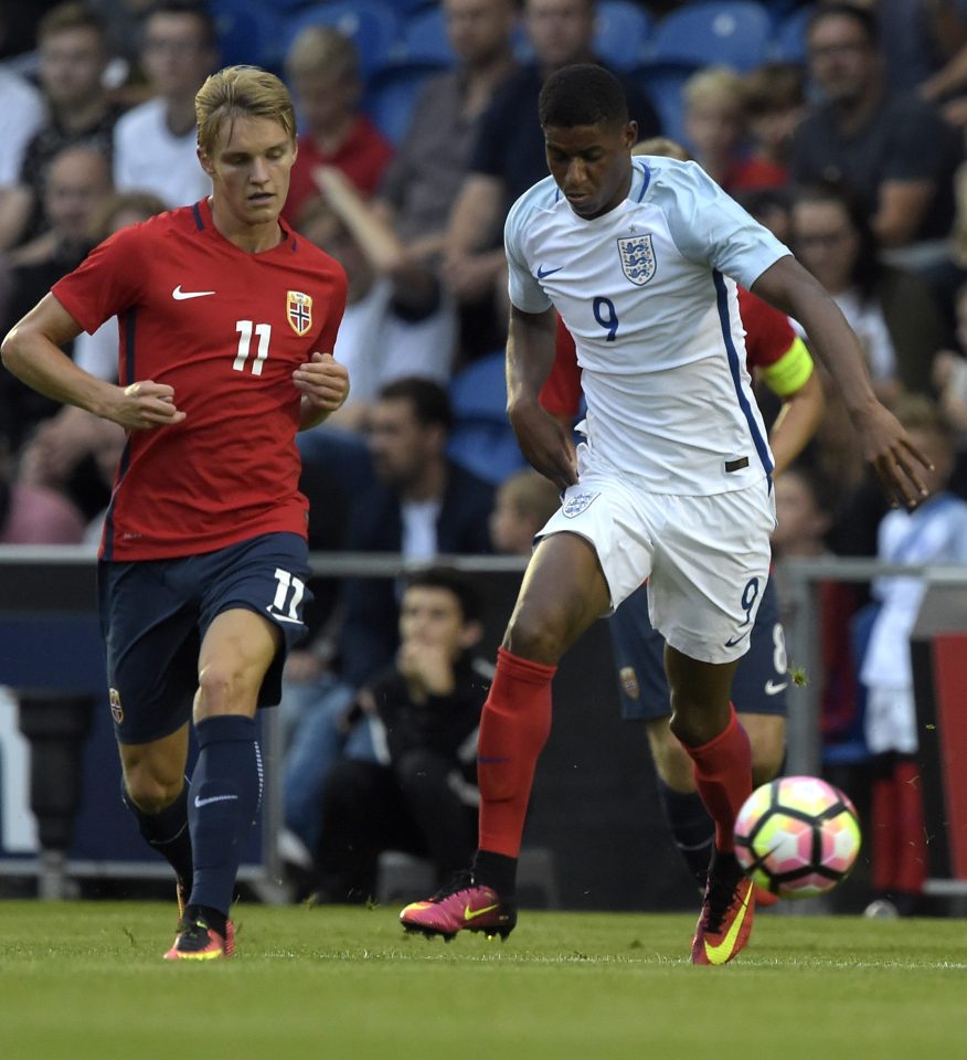  Rashford chases after Norway and Real Madrid's Martin Odegaard in the battle of the wonderkids