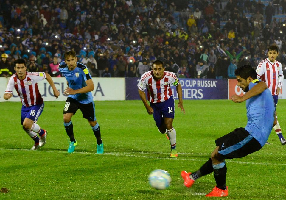 Uruguay's Luis Suarez takes a penalty to