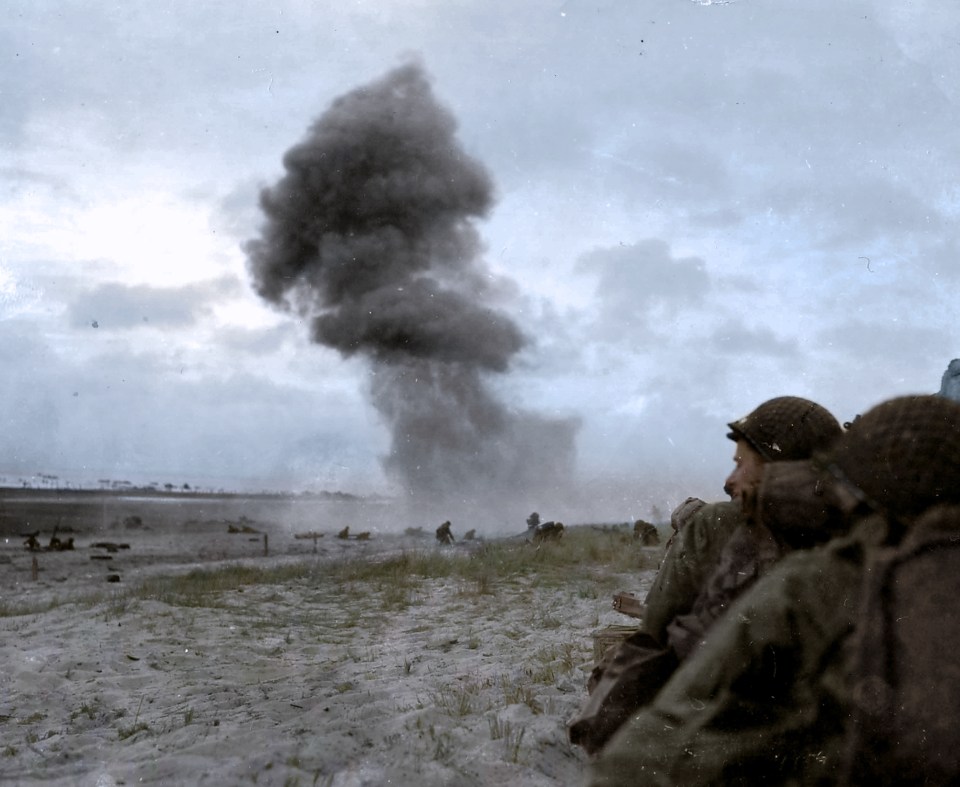  A plume of smoke rises over Utah beach in Normandy as the Allies storm ashore