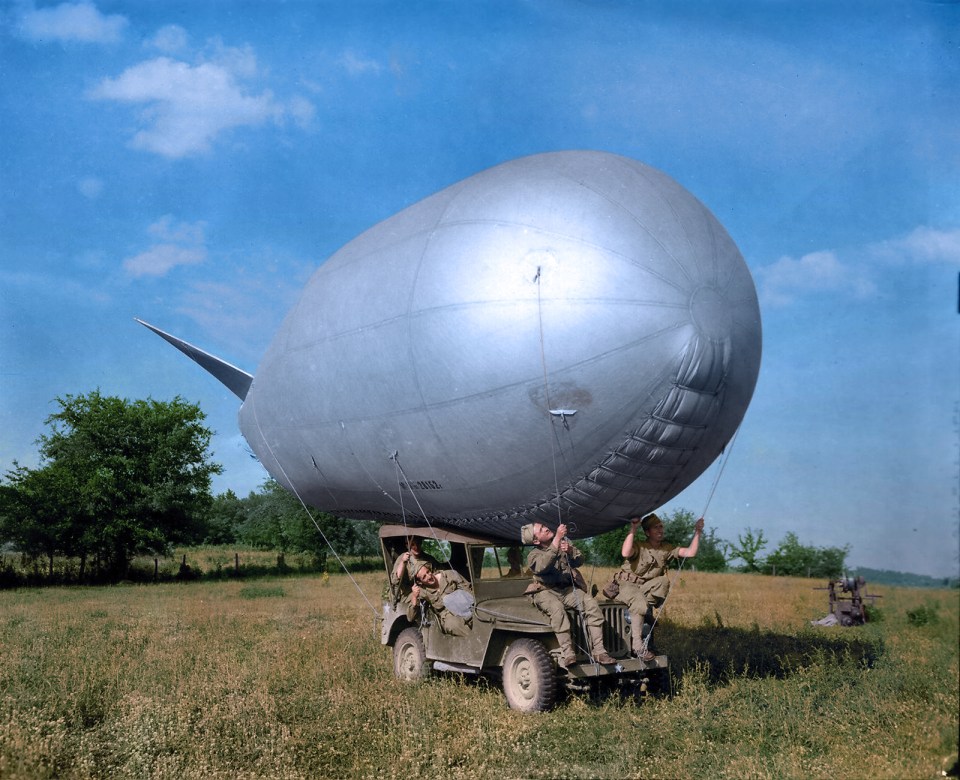  Soldiers try to attach the balloon to their car in a rare lighthearted moment