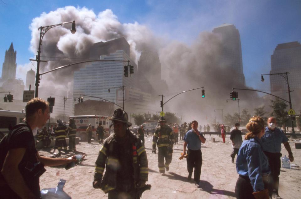  Witnesses and firefights leave the area of the attacks on September 11, 2001