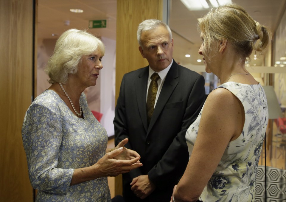 Camilla, Duchess of Cornwall, left, talks to Haydon and Melony Slack at the headquarters of Refuge, Britain's largest charity dealing with domestic violence, during a visit in London, Thursday, Sept. 8, 2016. Haydon and Melony are brother and sister-in law of Rachael Slack who was along with her son Auden, stabbed to death by Rachael's ex partner in 2010. (AP Photo/Alastair Grant, Pool)