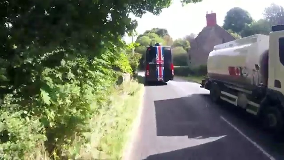  A truck was forced to stop on the other side of the road to allow the Team Sky bus through