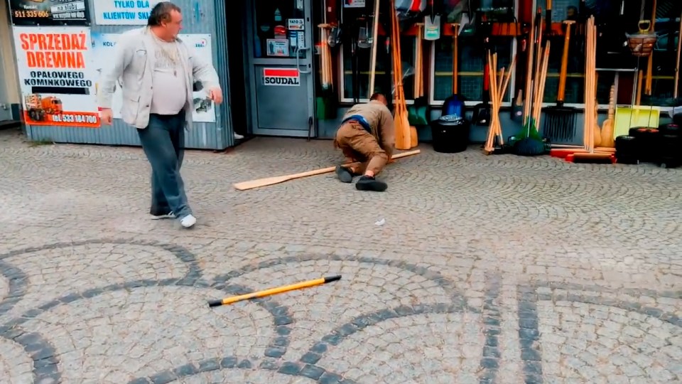  The drunk idiot falls to the ground after a brief exchange of blows