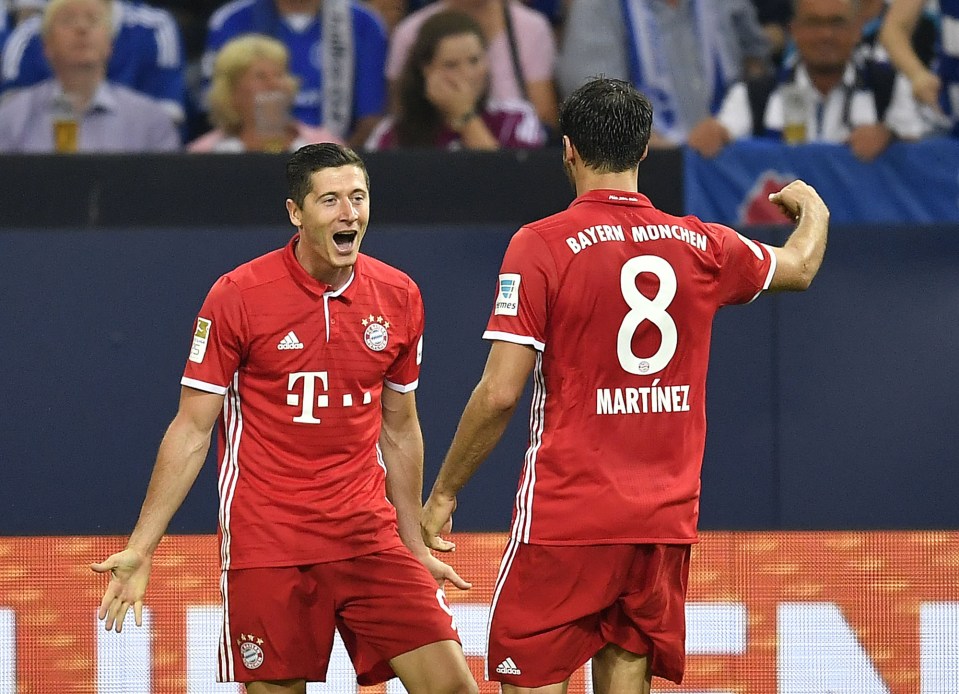  Robert Lewandowski celebrates after scoring the first goal against Schalke tonight