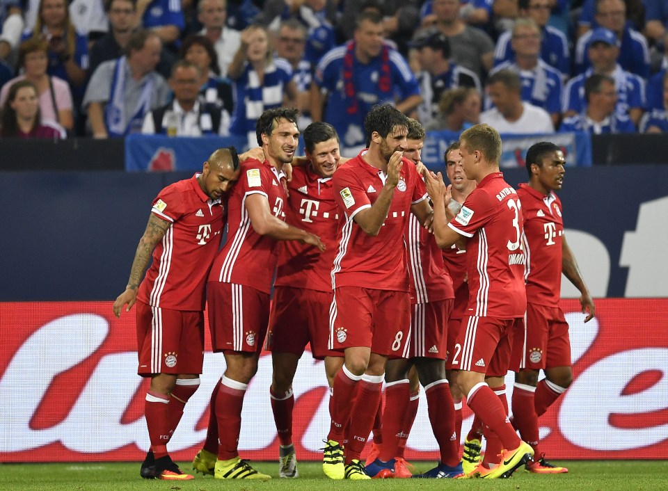  Bayern players celebrate after the deadlock was finally broken by their Polish star striker