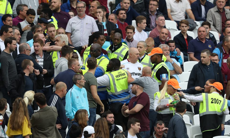  West Ham United fans and Watford fans clash during the Premier League match