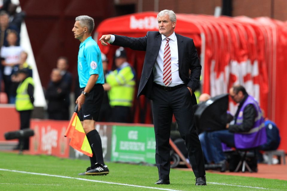  Mark Hughes will assess the Swiss international's calf injury before the clash