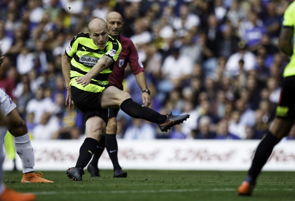  Aaron Mooy scored as Huddersfield opened up a four-point gap in the Championship