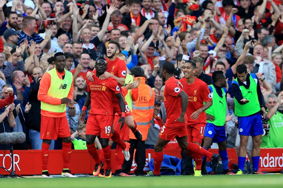  Midfielder Mane is mobbed by team-mates after making it 2-0 after 31 mins