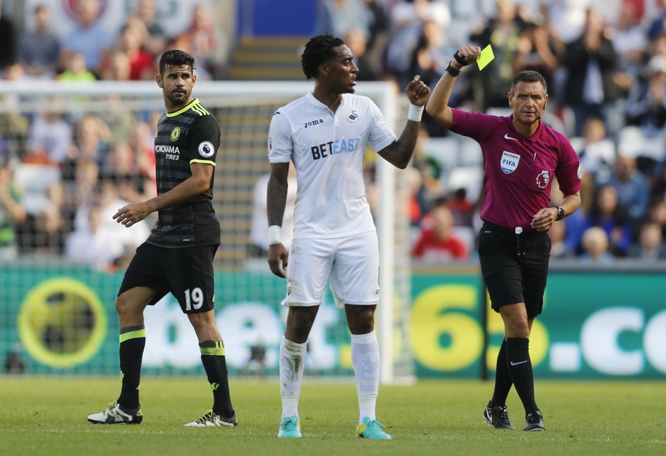 Diego Costa is shown the yellow card at Swansea - the third time he has been booked in four games this season