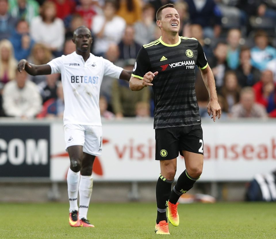  Centre-back Terry grimaces after suffering his ankle injury against Swansea