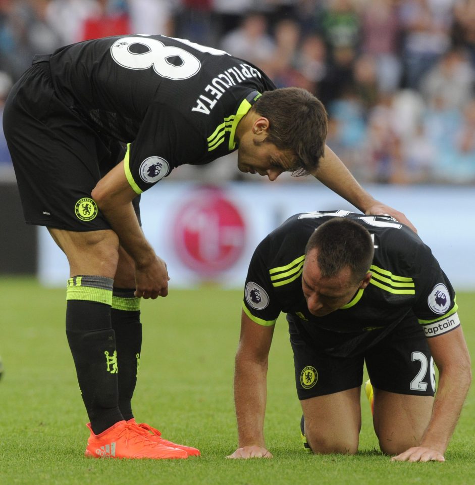  John Terry realises he is in trouble as he takes his time to get up against Swansea