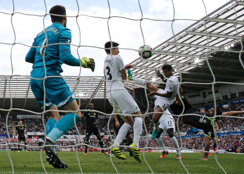 Diego Costa volleys acrobatically to level the scores for Chelsea against Swansea