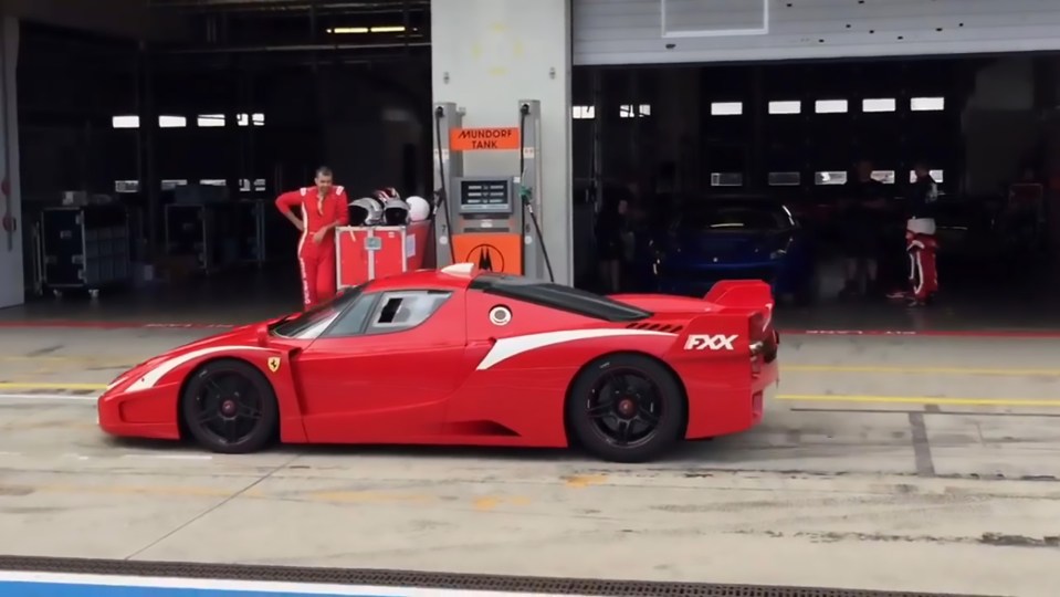 The Ferrari FXX side on in the pit lane