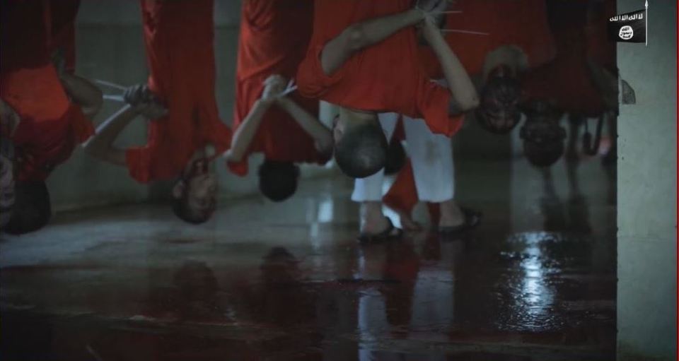  Chilling ... Men hang upside down moments before they are slaughtered 'like sheep' by ISIS