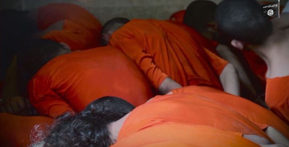  Fear ... Prisoners huddle together before they are executed in grisly film