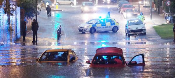 Cars were stranded as Manchester was hit by flash floods yesterday evening