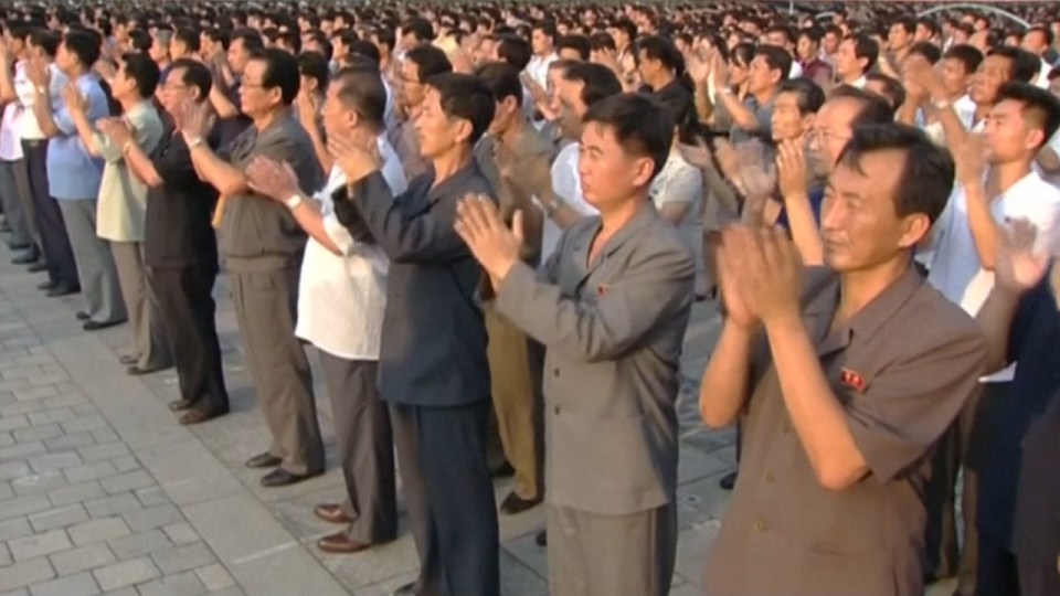  Footage showed citizens clapping along in eerie synchronisation