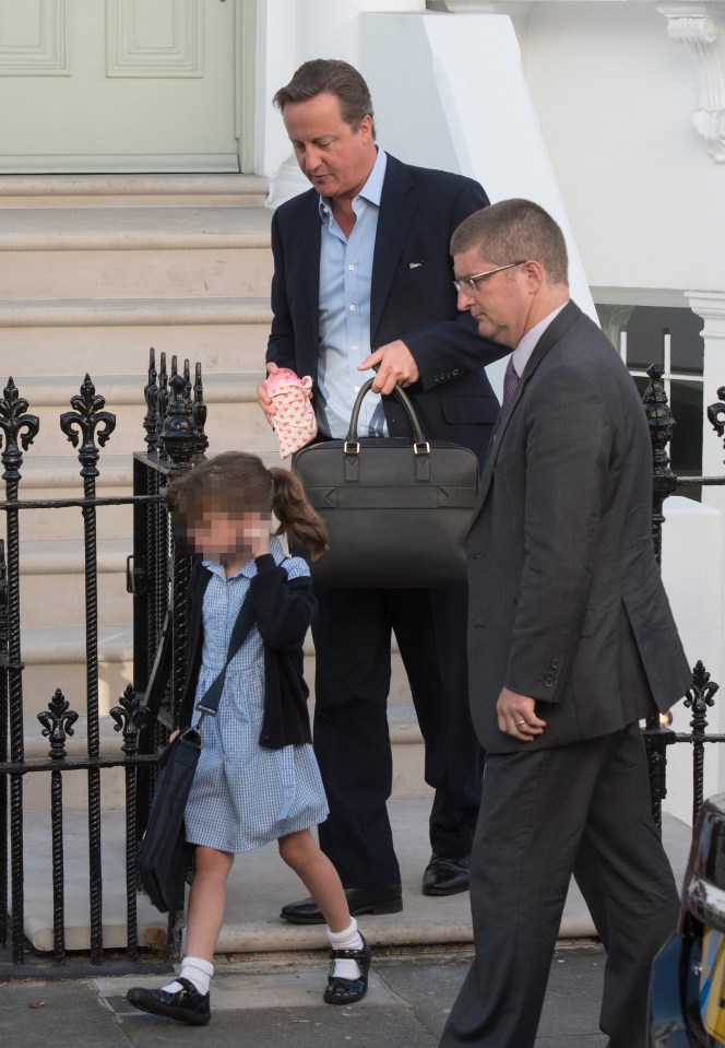  David Cameron carried six-year-old Florence's water bottle in a pink bag decorated with hearts as they made their way to her school yesterday