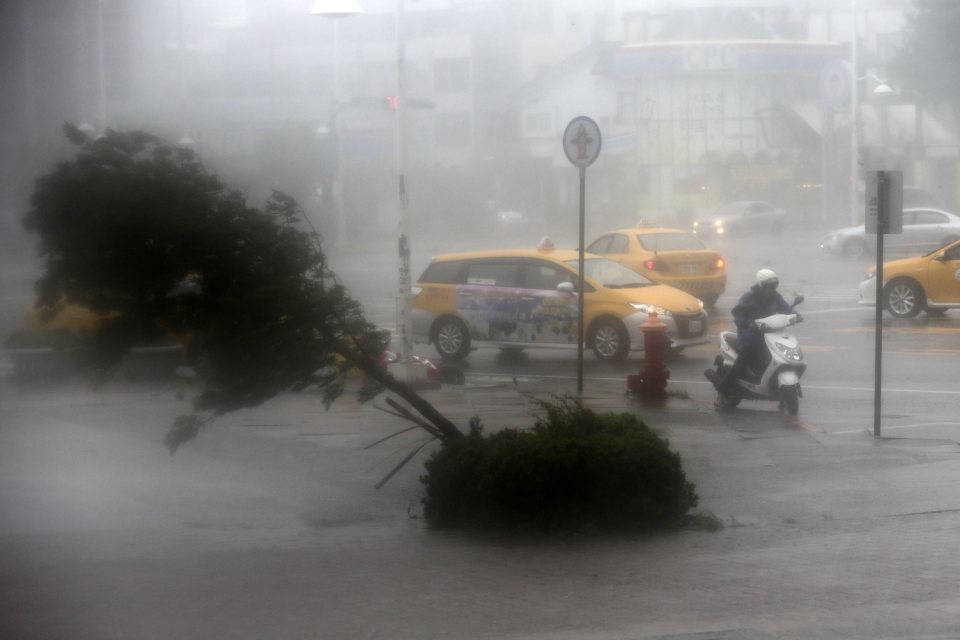  A motorist braves through high winds and rain of Super Typhoon Meranti in Kaohsiung, southern Taiwan