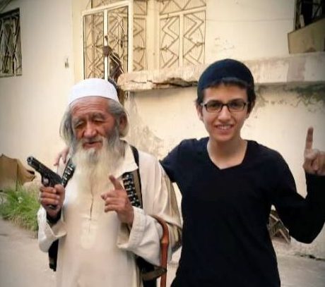  The 83-year-old jihadi poses with a teenager who is believed to be his grandson