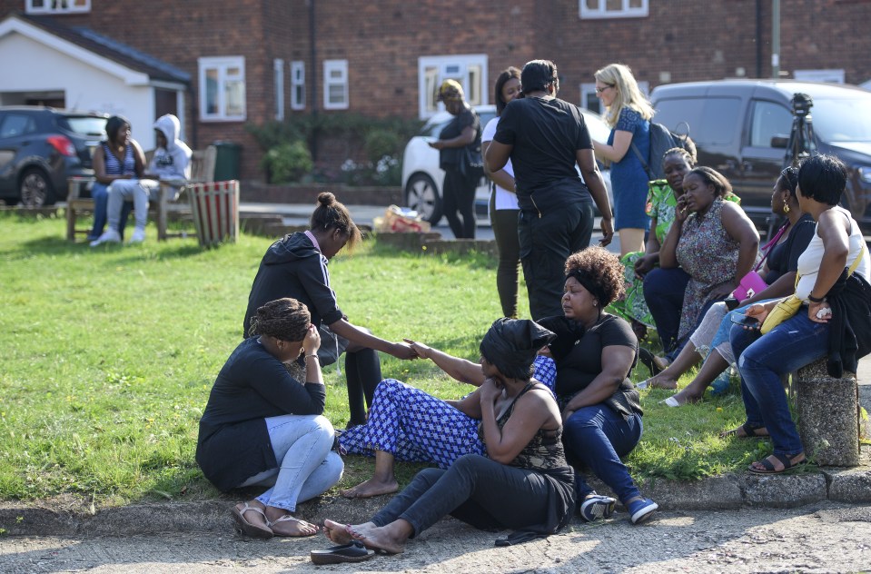  Family and friends consoled each other following the shooting in the early hours of this morning