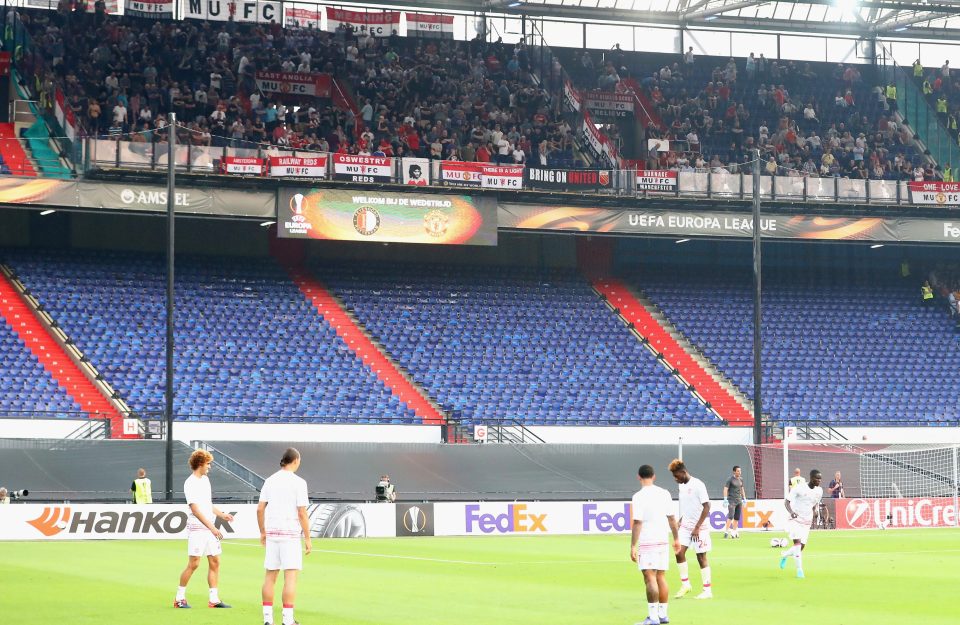 United fans stuck up high, far away from everyone else to minimise the threat of any issues