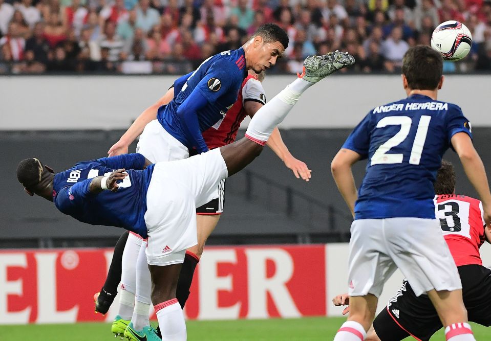  Smalling almost gets a kick in the face from united team-mate Paul Pogba