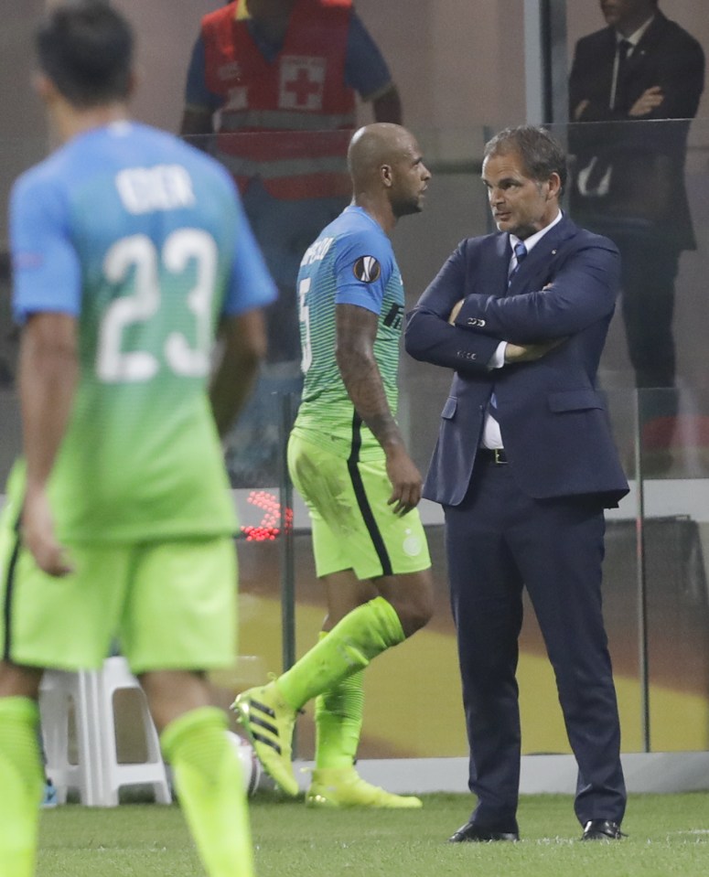 Felipe Melo walks past Inter Milan boss Frank de Boer after their defeat