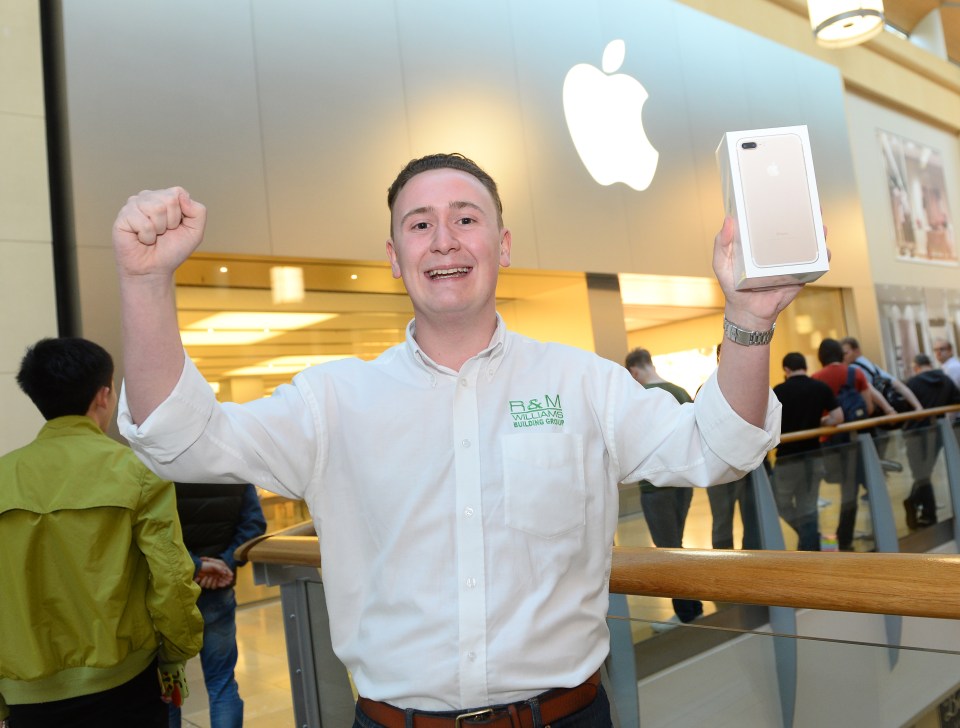  WALES ... A customer in Cardiff celebrates after picking up his iPhone 7