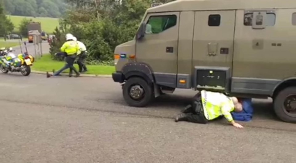  Police attempt to reach the man after the incident brought rush hour traffic to a standstill