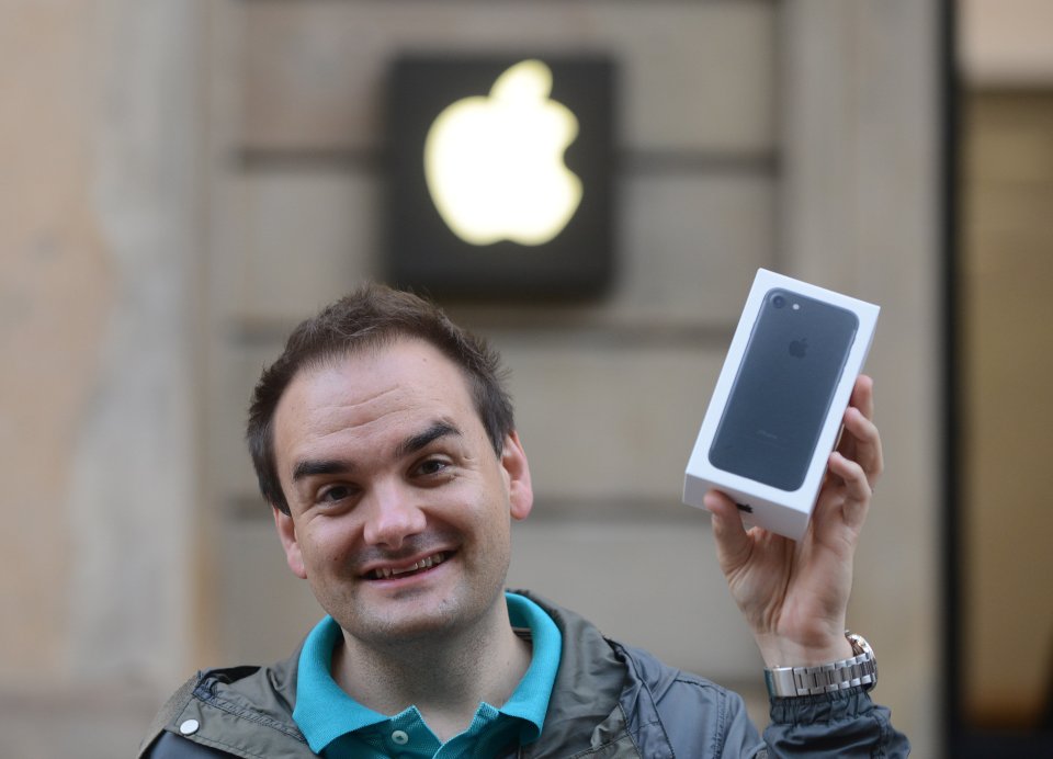  SCOTLAND ... In Glasgow, Paul Tyler, 35, was the first through the city's Apple shop, picking up his gold iPhone