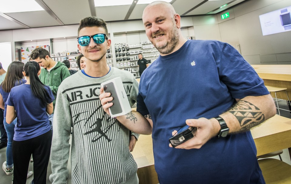  ITALY ... Two happy customers show off their iPhone 7 in Bergamo, Italy