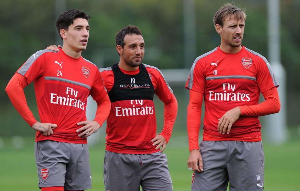  Bellerin, Cazorla and Monreal during a soggy training session today