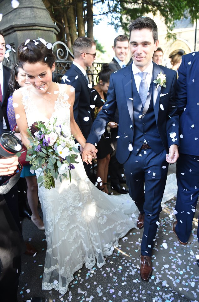  The couple smiled as well wishers showered them with confetti after the ceremony