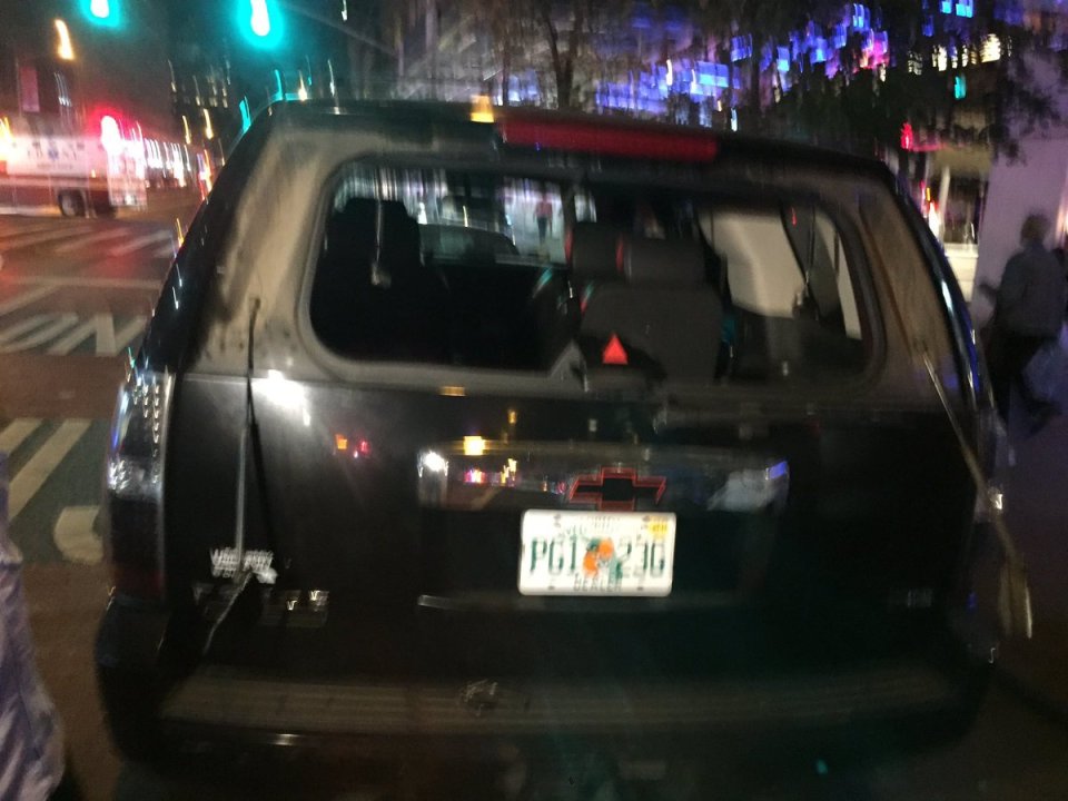  A car seen driving through the area had its rear window blown out