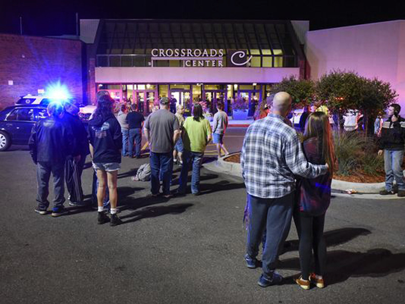  People gather outside the Crossroade Centre mall in Minnesota following a stabbing attack