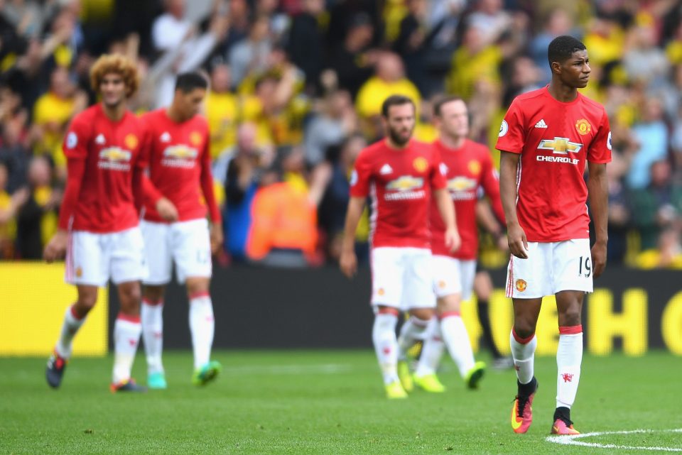  Manchester United players react at the final whistle at Vicarage Road