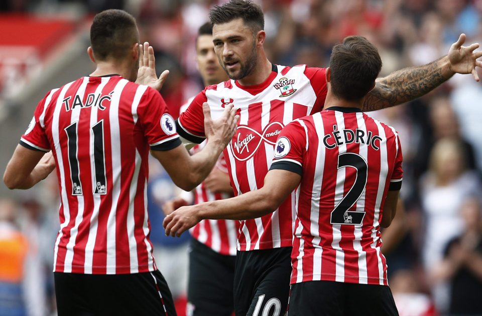  Saints players flock to congratulate scorer Charlie Austin