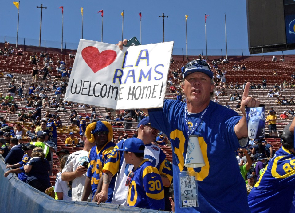  A fan holds up a message as the team played their first home game