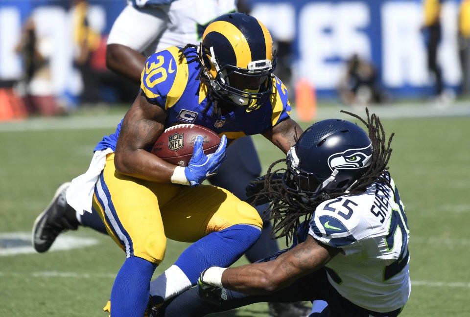  Todd Gurley is tackled by Seahawks defender Richard Sherman