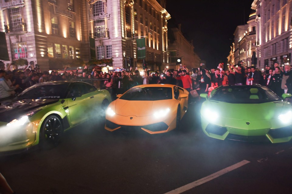  Three drivers lined up in their (from left to right) Nissan GTR which can be worth £229,000, Lamborghini Huracán (£205,000) and a Lamborghini Aventador (£460,000) as chaotic scenes erupted around Piccadilly Circus