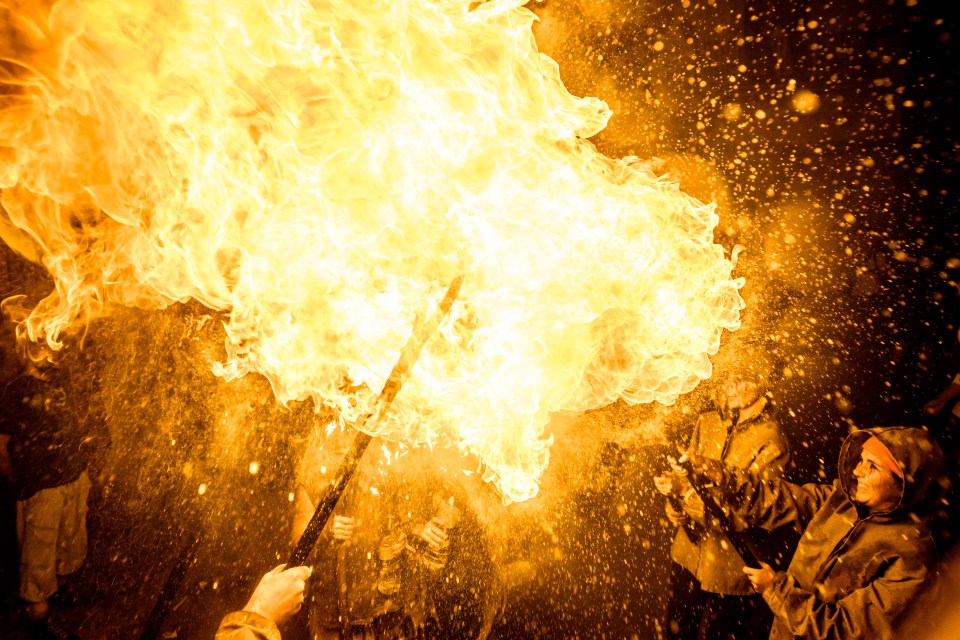  A fire-eater of the 'Diables de Terrassa' performs